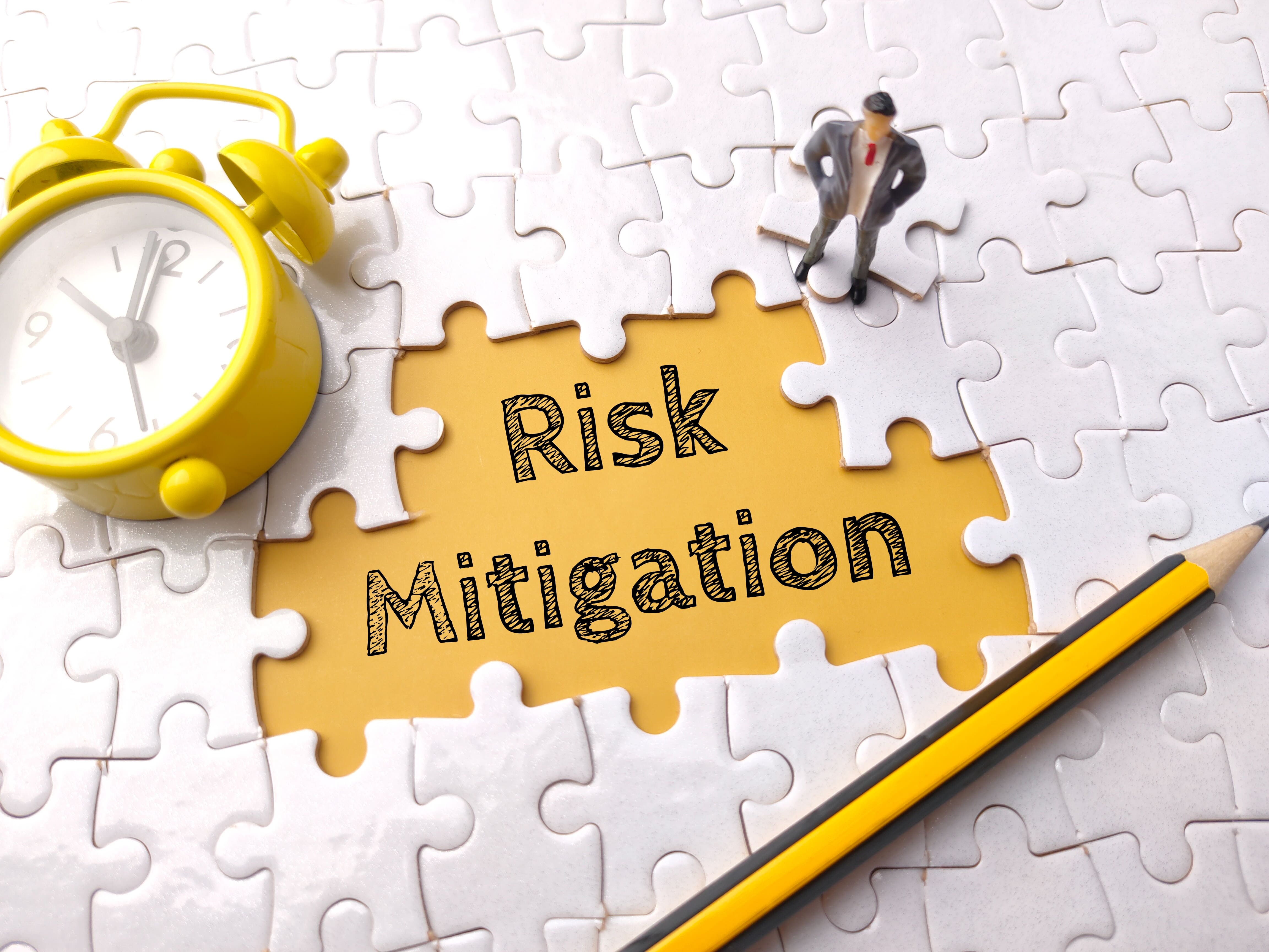 text-risk-mitigation-white-puzzle-background 